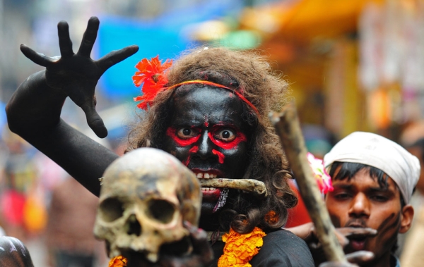 A Hindu devotee holds a human skull during a procession for Maha Shivaratri, dedicated to the Hindu god Lord Shiva, in Allahabad, India on February 27, 2014. (Sanjay Kanojia/AFP/Getty Images)