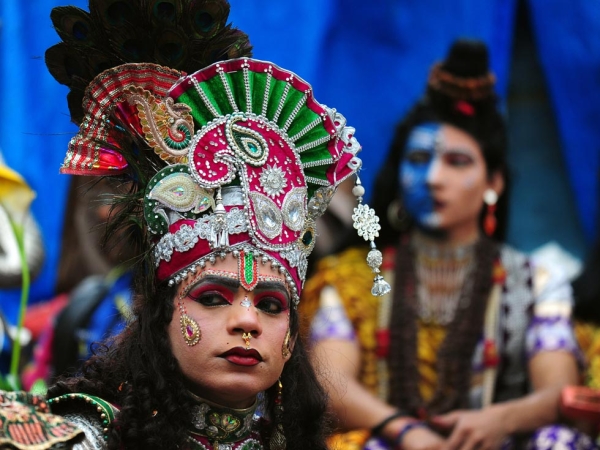 A dressed up devotee looks on during a procession for Maha Shivaratri in Allahabad, India on February 27, 2014. (Sanjay Kanojia/AFP/Getty Images)
