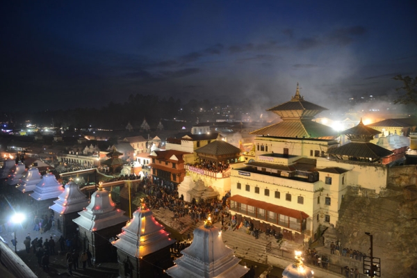 Hindu devotees gather at dusk at the Pashupatinath temple during the Maha Shivaratri festival in Kathmandu, Neoal on February 27, 2014. (Prakash Mathema/AFP/Getty Images)