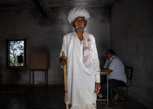 An Indian man pauses after voting at a polling station on April 17, 2014 in the Jodhpur District in the desert state of Rajasthan, India. (Kevin Frayer/Getty Images)