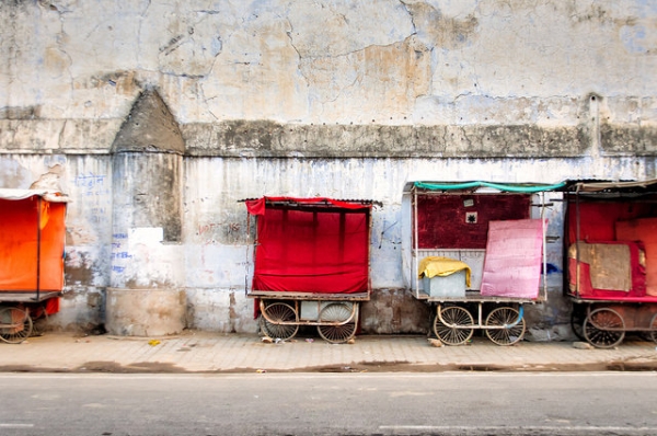 A group of pushcarts are neatly lined up against a decaying wall in Rajasthan, India on November 3, 2014. (Sven Van Echelpoel/Flickr)