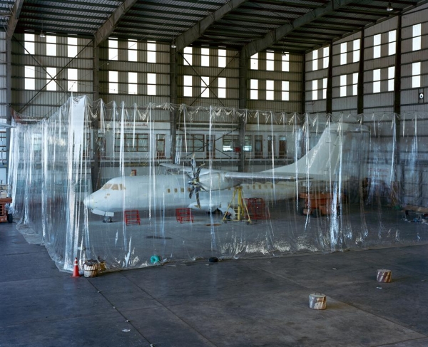 A plane waits to be painted in a hangar at Yangon International Airport. (Andrew Rowat)