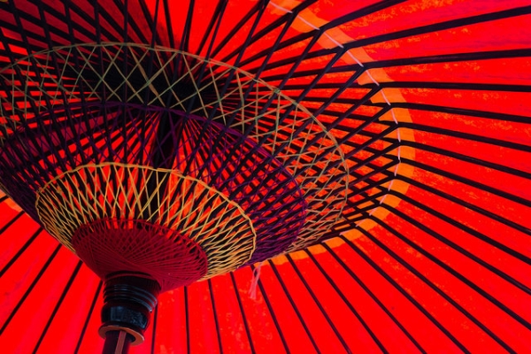 A close-up of the inside of a red umbrella made of paper in Narita, Japan on May 22, 2015. (drufisher/Flickr)
