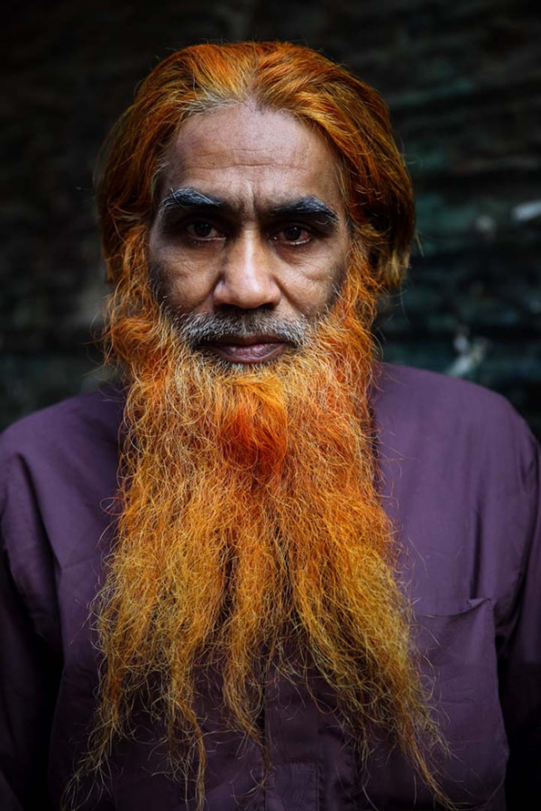 Portraits of men in Bangladesh who have dyed their hair and/or their beard using henna for an orange-red tint. Khairul Mollah with a flowing orange henna-dyed beard. (GMB Akash)