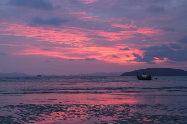 As the sun sets over the water, the skies turn purple in Krabi, Thailand on August 16, 2015. (Mr. Mularella/Flickr)