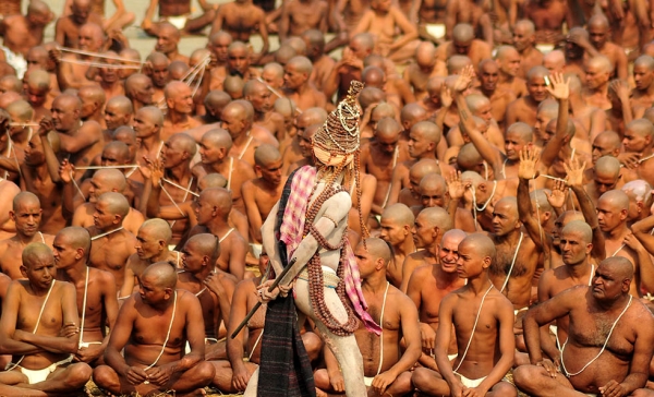 Newly initiated "Naga Sadhus" perform rituals on the bank of the Ganga River during the Kumbh Mela in Allahabad, India on January 30, 2013. During every Kumbh Mela, the diksha — ritual of initiation by a guru — program for new members takes place. (Sanjay Kanojia/AFP/Getty Images)