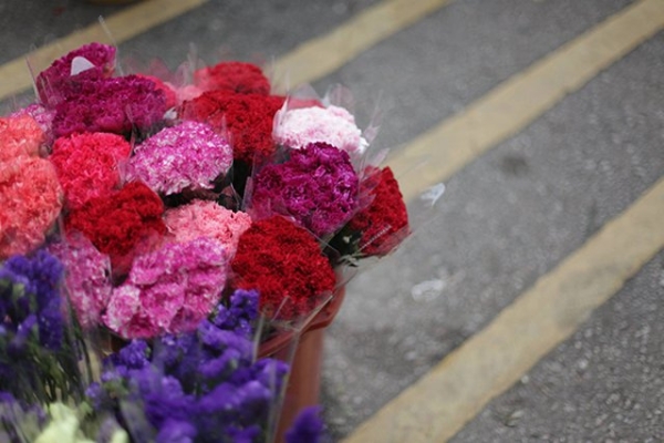 A bucket full of brightly colored carnations at the flower market in Kowloon, Hong Kong on November 21, 2015. (Tahiat Mahboob)