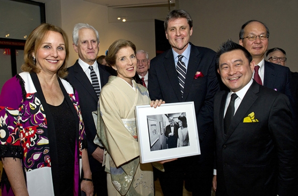 Ambassador Caroline Kennedy holds a photo of her mother, Jacqueline Kennedy, when she visited Asia Society in 1965 at the opening of the exhibition "Gods, Thrones, and Peacocks: Northern Indian Painting From Two Traditions." (Elena Olivo/Asia Society) 