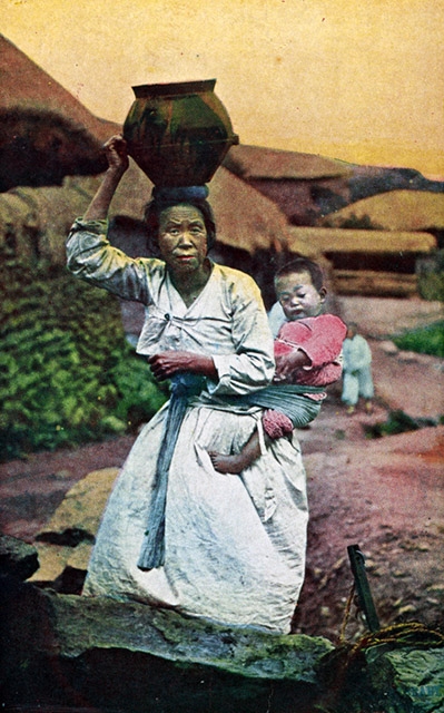 "Woman carrying water jar and baby." (Hinode Shoko/New York Public Library)