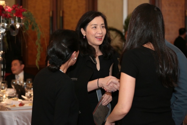 Lulu C. Wang, Vice Chair of the Board, Asia Society (left), introduces Jinqing Caroline Cai, President of Christie’s China, to a guest.