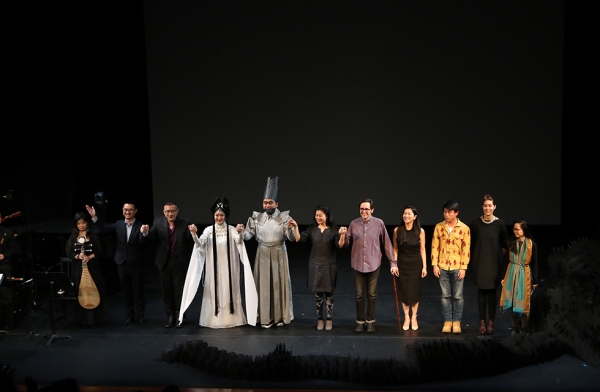 The opera singers, composer, librettists, and director are joined by the ensemble of behind-the-scenes designers and musicians that contribute to the production of 'Paradise Interrupted' on April 5, 2016. (Ellen Wallop/Asia Society)