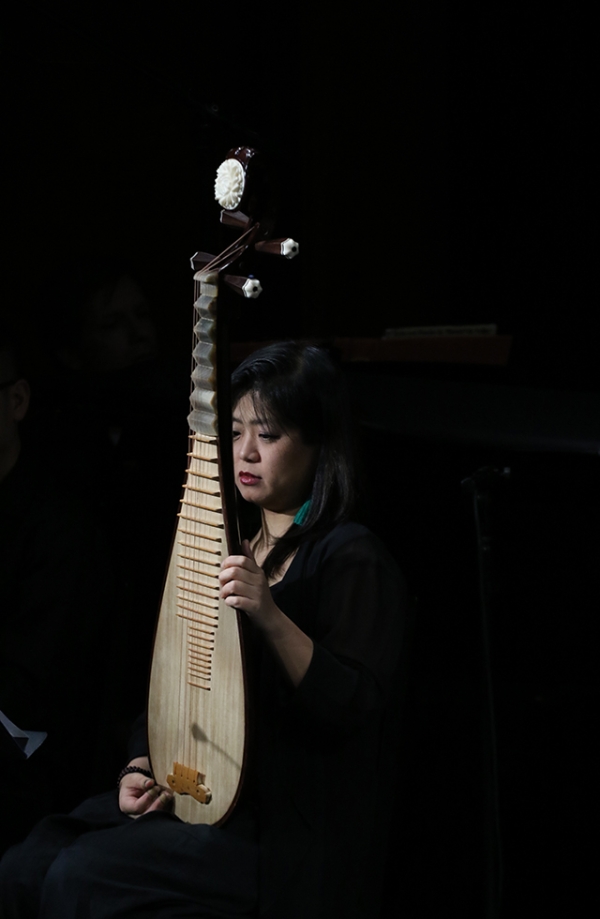 A member of the musical ensemble Zhou Yi play the Chinese pipa during a demonstration of 'Paradise Interrupted' on April 5, 2016. (Ellen Wallop/Asia Society)