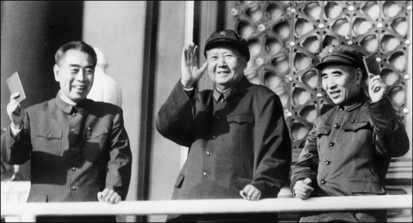 (L to R) Prime Minister Zhou Enlai, Chairman Mao Zedong, and Minister of Defense Lin Biao wave at Tiananmen Square in Beijing on October 3, 1967 as they review troops celebrating the 18th anniversary of the Republic. (AFP/Getty Images)