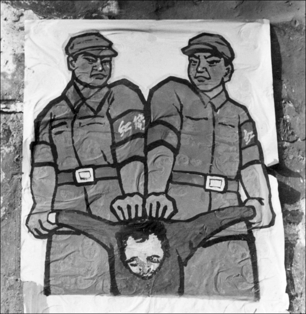 A poster is displayed in late 1966 in Beijing features how to deal with a so-called "enemy of the people." (Jean Vincent/AFP/Getty Images)