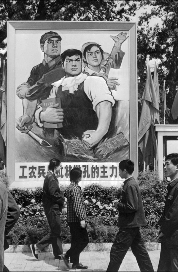 In May 1974, Beijing residents pass by a poster saying "Peasants and soldiers are the principal force in the fight against Lin Biao and Confucius." Once Mao's designated successor, Lin was purged in 1971 and killed in a plane crash, apparently while attempting to flee to the Soviet Union after an attempted coup against Mao. (AFP/Getty Images)