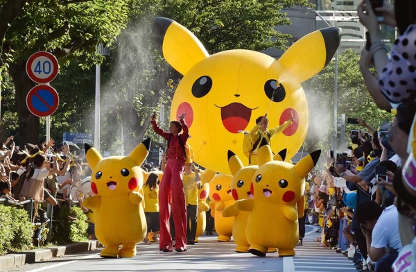Performers dressed as Pikachu, the popular animation Pokemon series character, perform in the Pikachu parade in Yokohama on August 7, 2016. Some 50 life-size Pikachu characters, the most famous from the Pokemon game, marched along the city's waterfront street as visitors took mobile phone pictures and videos of them in scorching sunshine.  (Kazuhiro Nogi/AFP/Getty Images)