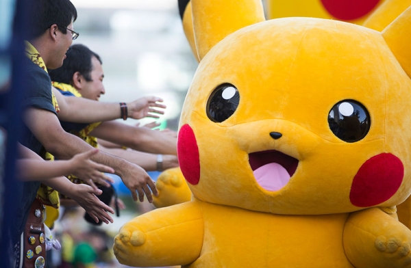 Performers dressed as Pikachu march during the Pikachu Outbreak event on August 7, 2016 in Yokohama, Japan. (Tomohiro Ohsumi/Getty Images)