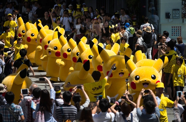 Performers march during the Pikachu Outbreak event hosted by The Pokémon Co. on August 7, 2016 in Yokohama, Japan. (Tomohiro Ohsumi/Getty Images)
