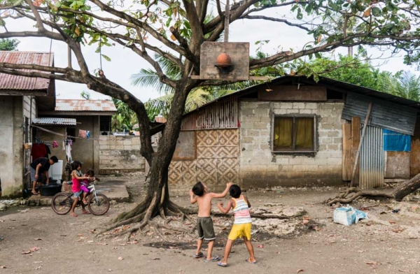 In the poorer villages, basketball hoops and backboards are made from whatever materials are available and fixed onto trees or makeshift wooden structures. Cebu, Philippines. (Richard James Daniels)