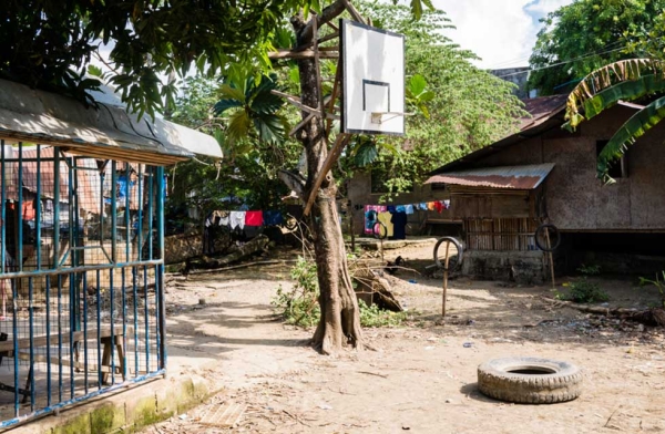In a Catholic country like the Philippines, there are probably more hoops than churches. In this image, a single hoop is the focal point of a local village next to a small provincial chapel on the left. Cebu, Philippines. (Richard James Daniels)