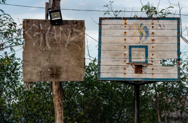 A hoop shifts from a makeshift backboard to a more upscale version. Many of the hoops that I have documented will disappear as the Philippines becomes more affluent. Cebu, Philippines. (Richard James Daniels)