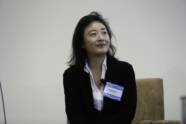 Shan Wenhui, Founder of UrbanDATA, listens to one of her fellow panelists. (Photo by Ryan Miller/Capture Imaging)