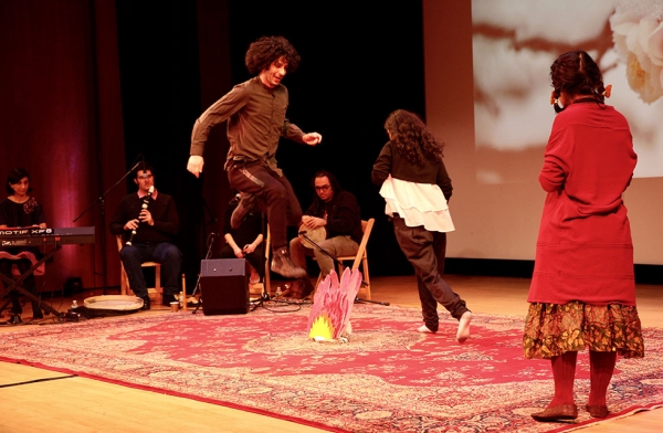 Performers from J-Hoon Musical Ensemble participate in the Nowruz tradition of "chaharshanbeh suri," or fire jumping, at Asia Society New York on March 18, 2017. (Ali Yousefian/Asia Society)