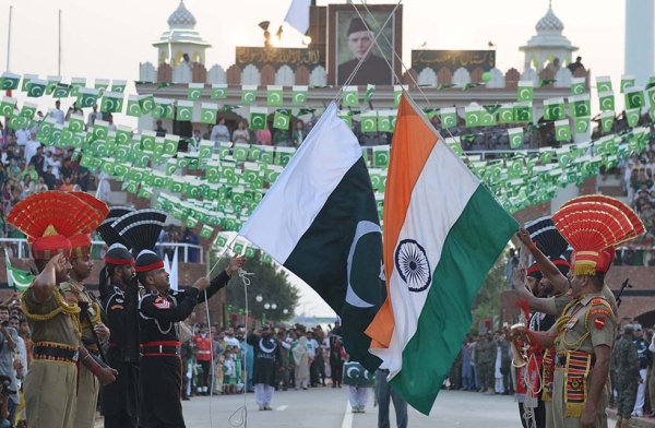 Pakistani Rangers (black) and Indian Border Security Force personnel (brown) perform during the daily beating of the retreat ceremony at the India-Pakistan Wagah Border Post on August 14, 2017. (Narinder Nanu/AFP/Getty)