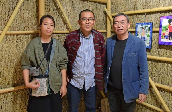 'After Darkness: Southeast Asian Art in the Wake of History' artists Nguyen Thi Thanh Mai, Htein Lin, and FX Harsono pictured in front of Nguyen's piece 'Travels' at Asia Society New York on September 12, 2017. (Elsa Ruiz/Asia Society)