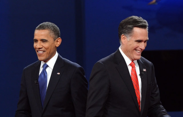 U.S. President Barack Obama (L) and former Massachusetts Governor Mitt Romney finish their debate at the University of Denver in Denver, CO on Oct. 3, 2012. (Saul Loeb/AFP/GettyImages) 