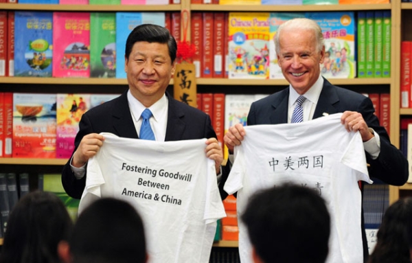 U.S. Vice President Joe Biden and Xi Jinping (then-Vice President of China) display shirts with a message given to them by students at the International Studies Learning School in Southgate, outside of Los Angeles, on Feb. 17, 2012. (Frederic J. Brown/AFP/Getty Images) 