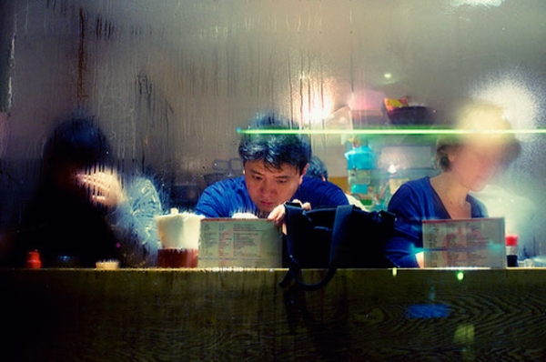 Customers studying a menu at a Japanese restaurant. (christophe HUE/flickr)