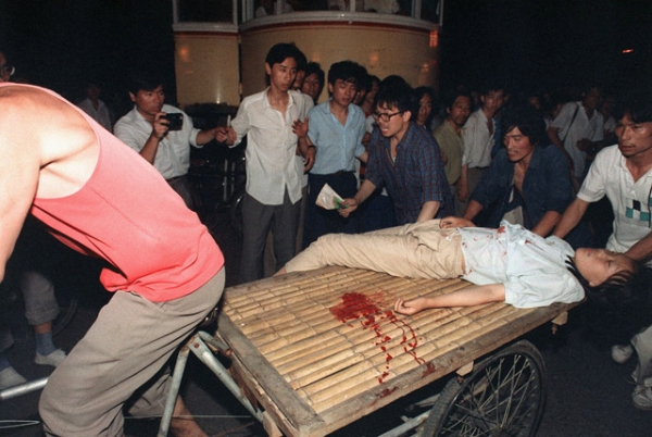 A girl wounded during the clash between the army and students on June 4, 1989 near Beijing's Tiananmen Square is carried out by a cart. (Manuel Ceneta/AFP/Getty Images)