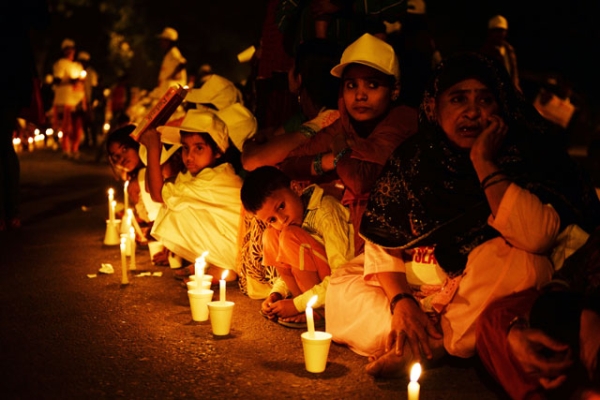 Children are pictured with candles during a protest against child slavery attended by Indian Nobel laureate Kailash Satyarthi in New Delhi on Nov. 22, 2014. (Chandan Khanna/AFP/Getty Images)