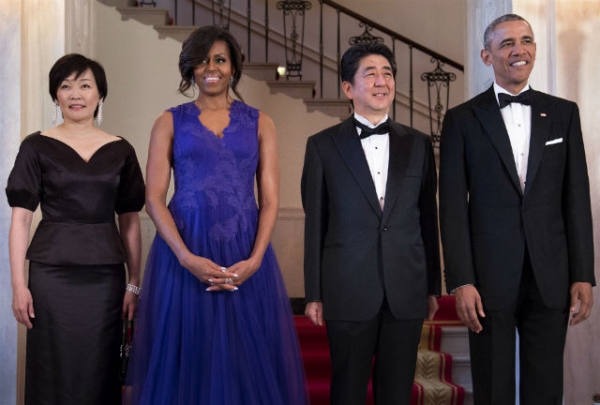 Japan's Prime Minister Shinzo Abe and his wife Akie Abe  pose with US President Barack Obama and US First Lady Michelle Obama before a state dinner at the White House April 28, 2015 in Washington, DC. (BRENDAN SMIALOWSKI/AFP/Getty Images)
