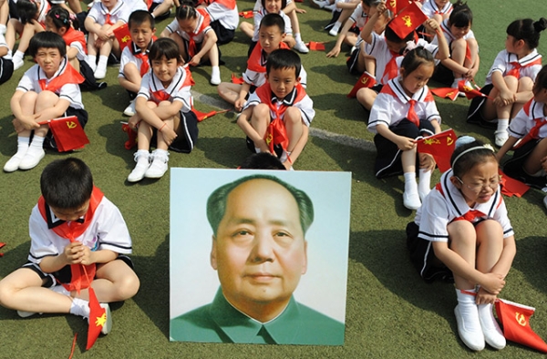Children in Taiyuan, China in 2011 celebrate the 90th anniversary of the founding of China's Communist Party. (STR/AFP/Getty Images)