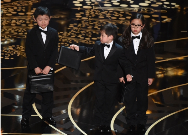 Children represent accountants from PricewaterhouseCoopers on stage at the 88th Oscars on February 28, 2016 in Hollywood, California. (Mark Ralston/AFP/Getty Images)