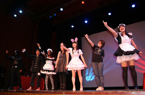 On October 15, 2010, audience members join Japanese singer Reni Mimura onstage for a performance during a cosplay competition at Asia Society in New York. (Elaine Merguerian/Asia Society)
