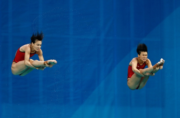 Tingmao Shi (R) and Minxia Wu (L) of China compete in the Women's Diving Synchronised 3m Springboard Final on Day 2 of the Rio 2016 Olympic Games at Maria Lenk Aquatics Centre on August 7, 2016 in Rio de Janeiro, Brazil. (Clive Rose/Getty Images)