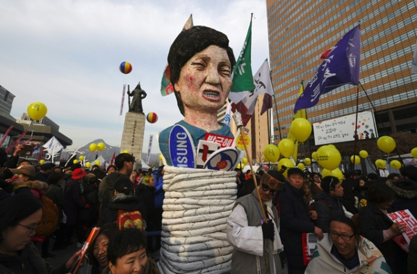 Protesters carry an effigy of South Korea's President Park Geun-Hye during a rally against Park in central Seoul on December 3, 2016. (Jung Yeon-Je/AFP/Getty Images)