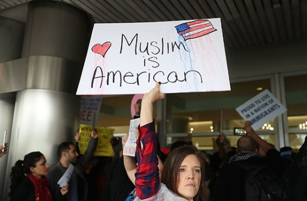 Demonstrators at Miami International Airport protest an executive order that President Donald Trump signed clamping down on refugee admissions and temporarily restricting travelers from seven predominantly Muslim countries on January 29, 2017. (Joe Raedle/Getty)