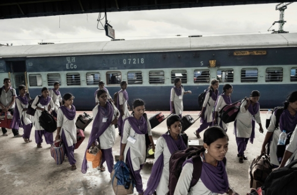 Girls arriving in Bangalore in June from rural villages for their new factory jobs. (Andrea Bruce/New York Times)