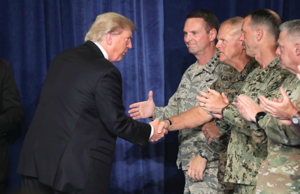 U.S. President Donald Trump greets military leaders before his speech on Afghanistan at the Fort Myer military base on August 21, 2017 in Arlington, Virginia. (Mark Wilson/Getty Images)