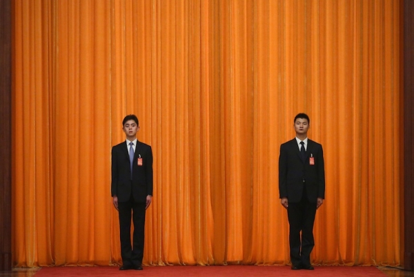  Two soldiers dressed as ushers guard in front of a curtain during a meeting of the opening session of the 18th Communist Party Congress at the Great Hall of the People on November 9, 2012 in Beijing, China. (Feng Li/Getty Images)