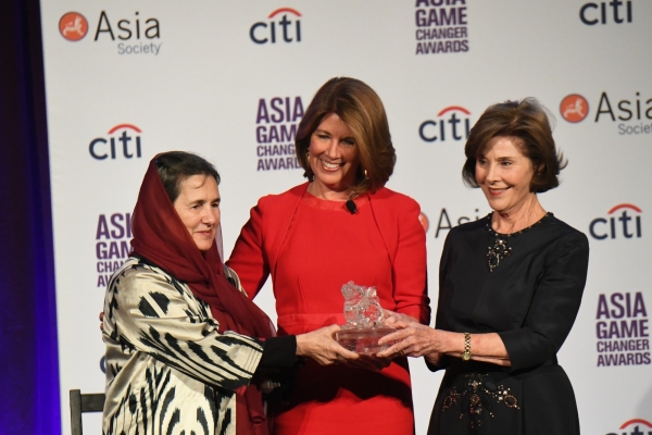 Rula Ghani, Sherrie Westin, and Laura Bush speak at the Asia Game Changer Awards.