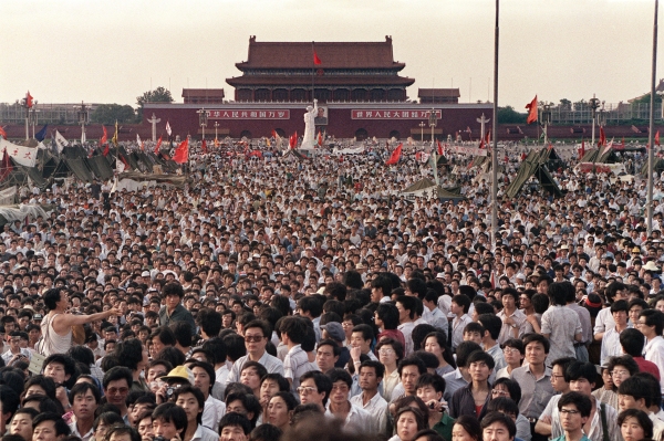 Thousands of people pour into Beijing's Tiananmen Square in the weeks before the June 4, 1989 massacre.