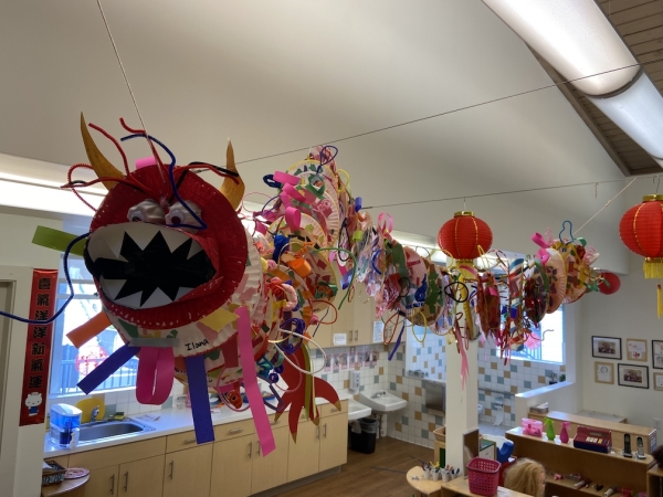 Chinese New Year dragon made by Pre-K students on display in the classroom