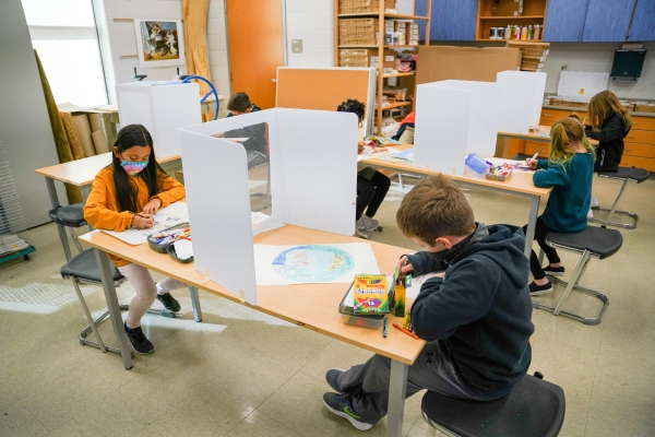 Students creating mandalas in art class taught in Mandarin 