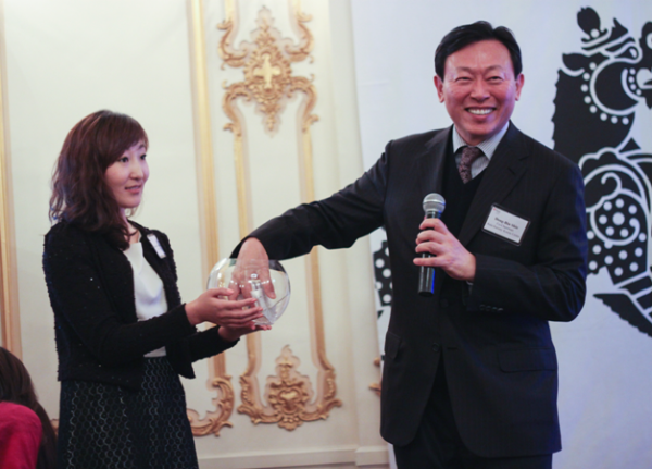 The Korea Center's co-chairman Dong-Bin Shin (R) draws raffle winners.