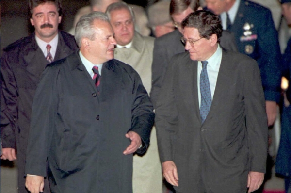 A high point of Holbrooke&apos;s long diplomatic career was his role in the Dayton peace accords of 1995, which brought an end to the conflict in Bosnia. Here, as US Assistant Secretary of State, he greets Serbian President Slobodan Milosevic (L) at Wright Patterson Air Force Base near Dayton, Ohio on Oct. 31, 1995. (Paul J. Richards/AFP/Getty Images)